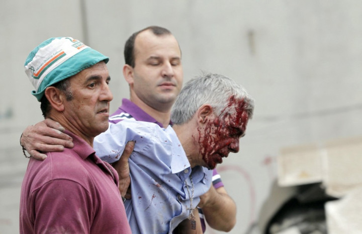 Francisco Jose Garzon Amo (centre )is supported by two men after Wednesday's crash Francisco Jose Garzon Amo (centre )is supported by two men after Wednesday's crash