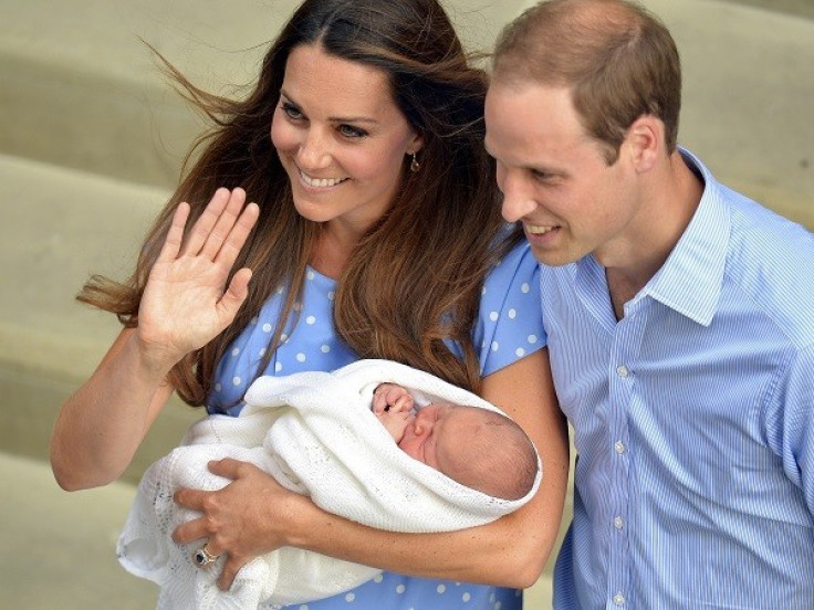 Kate Middleton holding Prince George, who is third in line to the British throne.