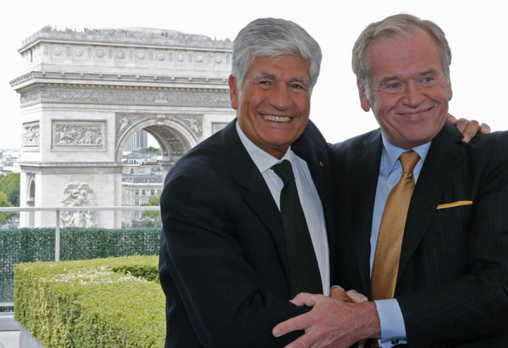 Maurice Levy (L) , French advertising group Publicis chief executive, and John Wren, head of Omnicom Group, have announced merger plans to create the world's biggest advertising group.
