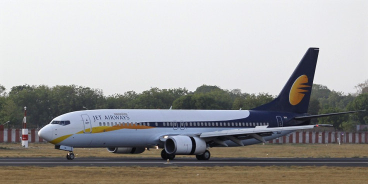 A Jet Airways passenger plane moves on the runway at a domestic airport in India.