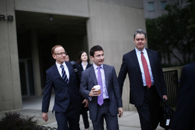 Frenchman Fabrice Tourre (C) arrives at the Manhattan Federal Court in New York, on 26 July, 2013.