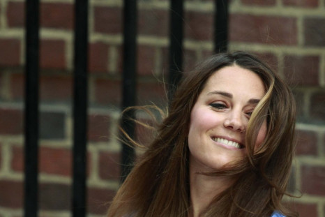Kate Middleton appears with her baby son outside the Lindo Wing of St Mary's Hospital, in central London on July 23, 2013, one day after she gave birth to the royal baby named George Alexander Louis. Kate, who is reportedly breast-feeding Prince George of