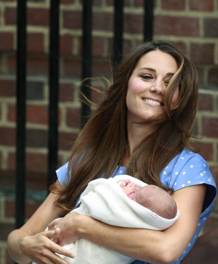 Kate Middleton appears with her baby son outside the Lindo Wing of St Mary's Hospital, in central London on July 23, 2013, one day after she gave birth to the royal baby named George Alexander Louis. Kate, who is reportedly breast-feeding Prince George of