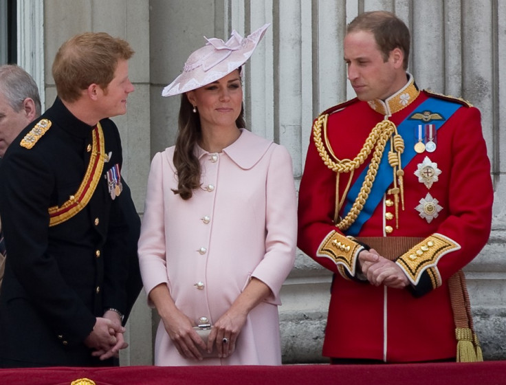 Prince Harry, Prince William and Catherine, Duchess of Cambridge stand on the balcony of Buckingham Palace after the Trooping the Colour ceremony on 15 June, 2013. Kate's pink dress worn for the event has secured her a place in Vanity Fair's best-dressed