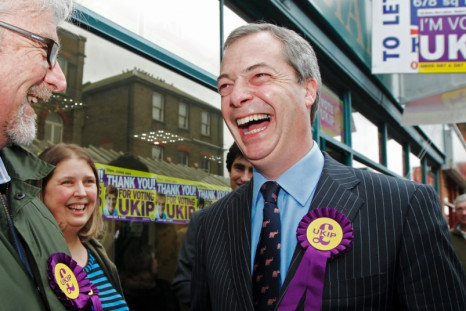 UK Independence Party (UKIP) leader Nigel Farage (R) thanks campaigners as he leaves the UKIP campaign office in Eastleigh, southern England (Photo: Reuters)