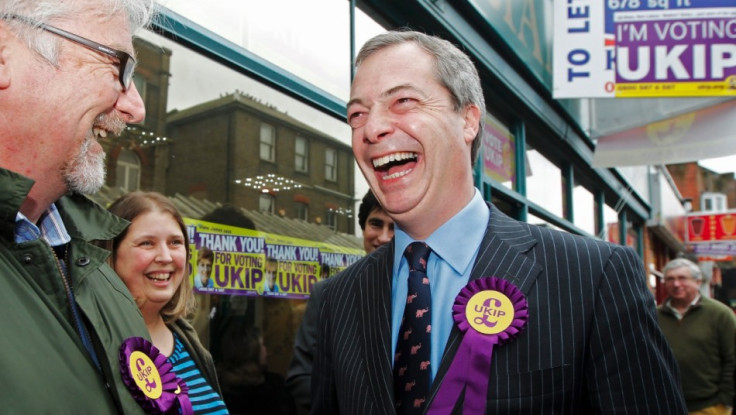 UK Independence Party (UKIP) leader Nigel Farage (R) thanks campaigners as he leaves the UKIP campaign office in Eastleigh, southern England (Photo: Reuters)