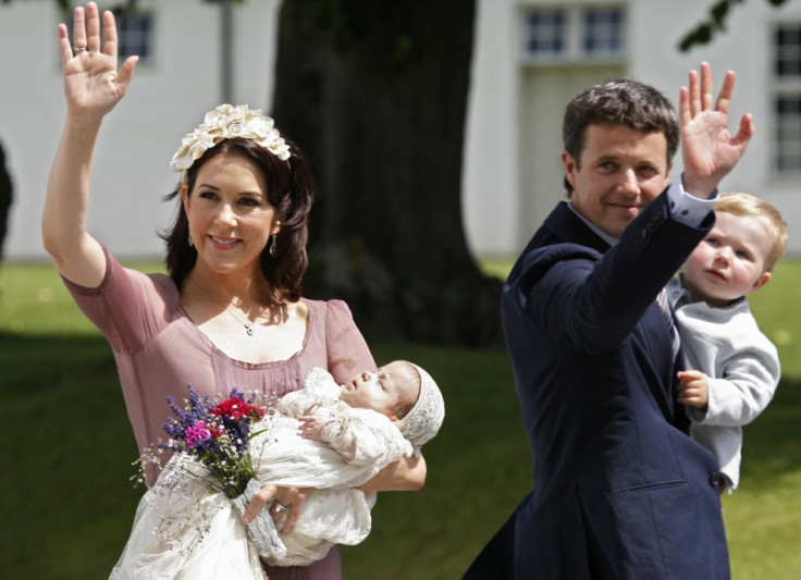 Denmark's Crown Princess Mary (L), holding Princess Isabella Henrietta Ingrid Margrethe and Crown Prince Frederik, holding Prince Christian, wave to well wishers following the christening of the new princess in Fredensborg in July 2007 photo. (Photo: