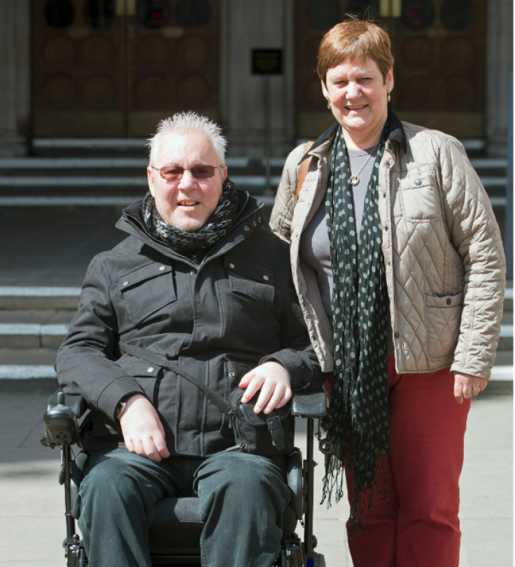 Pro-euthanasia campaigner Paul Lamb (L) poses for photographs with Jane Nicholson as he leaves the High Court in London in May (Photo: Reuters)