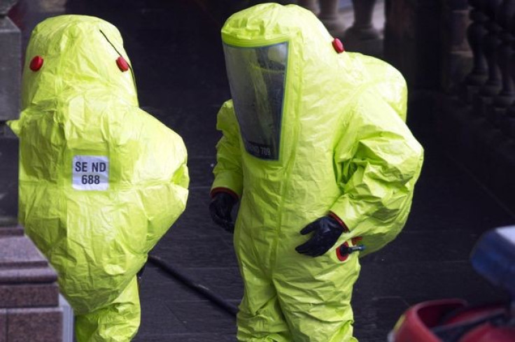 Officers in protective suits at the Scotsman hotel