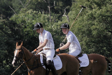 Prince Harry (R) and Prince William prepare to compete in a charity polo match at Coworth Park, southern England August 3, 2013.