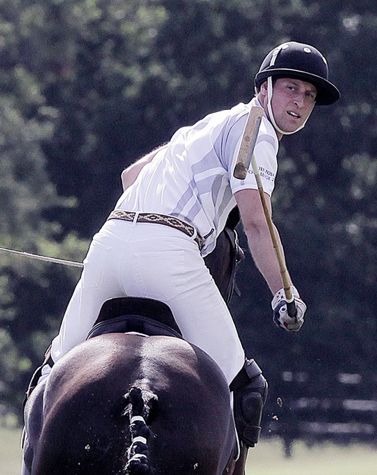 Prince William competes in a charity polo match at Coworth Park, southern England August 3, 2013. T