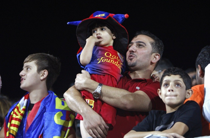 Swathes of youngsters clad in Barcelona shirts greeted the players in Dura