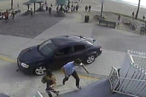 Pedestrians flee in terror as car mounts pavement at Venice beach