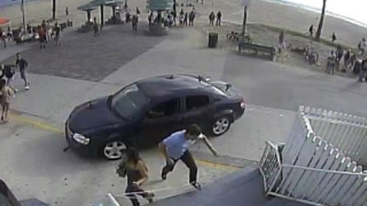 Pedestrians flee in terror as car mounts pavement at Venice beach