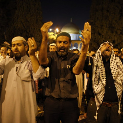 Observers of Lailat al-Qadr pray in front of the Dome of the Rock on the compound known to Muslims as Noble Sanctuary and to Jews as Temple Mount in Jerusalem's Old City on 4 August.