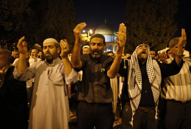 Observers of Lailat al-Qadr pray in front of the Dome of the Rock on the compound known to Muslims as Noble Sanctuary and to Jews as Temple Mount in Jerusalem's Old City on 4 August.