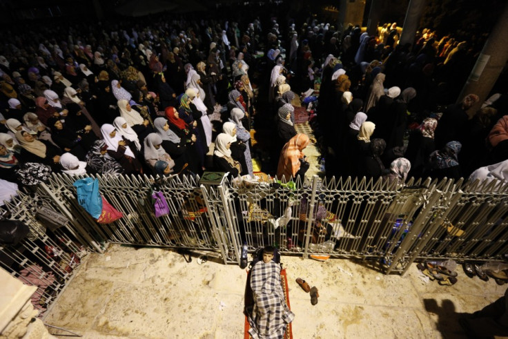Female Palestinian Muslims pray in front of the Dome of the Rock, in the Al Aqsa Mosque compound in Jerusalem early August 4, 2013, during Lailat-Al-Qadr. (Photo: Reuters)
