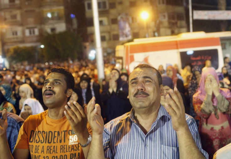 People perform Ramadan night prayers celebrating Lailat-Al -Qadr, or Night of Power, outside of a mosque in Cairo, August 4, 2013. (Photo: REUTERS/Asmaa Waguih)