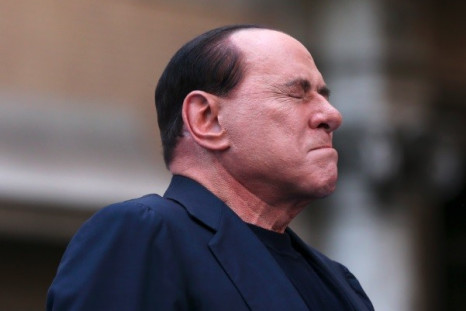 Former Italian Prime Minister Silvio Berlusconi closes his eyes in a gesture to supporters during a rally to protest his tax fraud conviction, outside his palace in central Rome August 4 (Photo: Reuters)