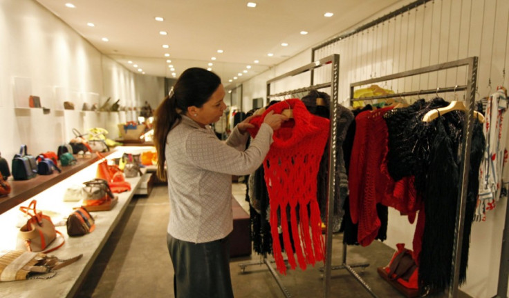 A saleswoman arranges clothing knitted for Brazilian fashion designer Raquel Guimaraes by prisoners of the Arisvaldo de Campos Pires. (Photo: REUTERS/Paulo Whitaker)