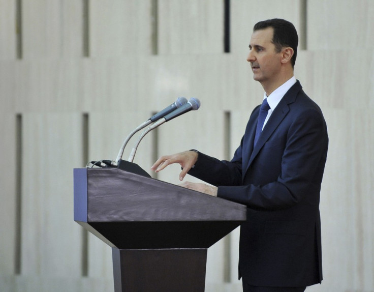Syria's President Bashar al-Assad delivers a speech while attending an Iftar, or breaking fast session, during the Muslim month of Ramadan in Damascus