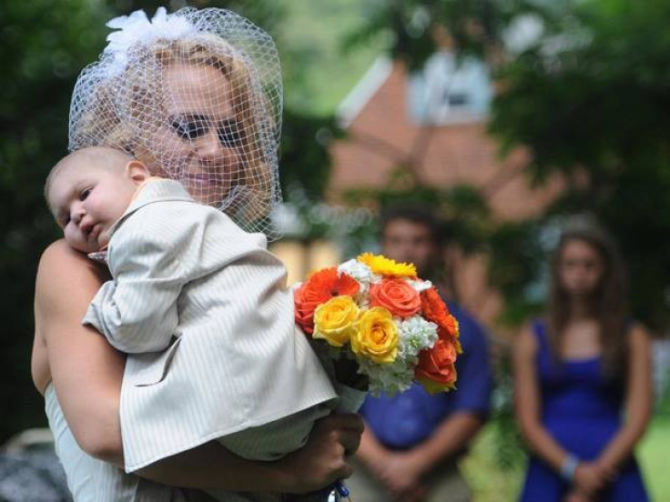 Two-year-old Logan served as best man at his parents' wedding before dying in his mother's arms two days later. He had cancer. (Photo: Facebook)