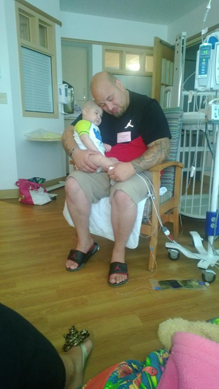 Logan, seen here with his father Sean, had to be with medical equipment always.  (Photo: Facebook)