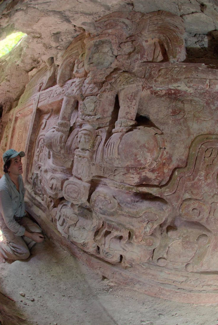 Francisco Estrada-Belli, who found the frieze, looks at it. (Photo: Estrada-Belli/© Holmul Archaeological Project)