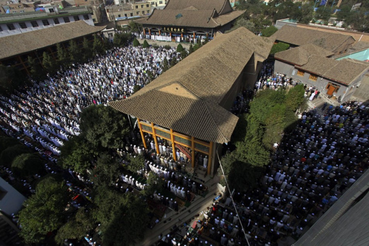 Muslims attend a massive prayer session at Dongguan Great Mosque during Eid al-Fitr, marking the end of Ramadan, in Xining, Qinghai province August 8, 2013. (Photo: REUTERS/Simon Zo)