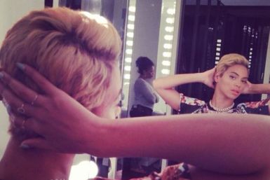 Beyoncé posted a photo of herself looking in the mirror, admiring her new pixie cut