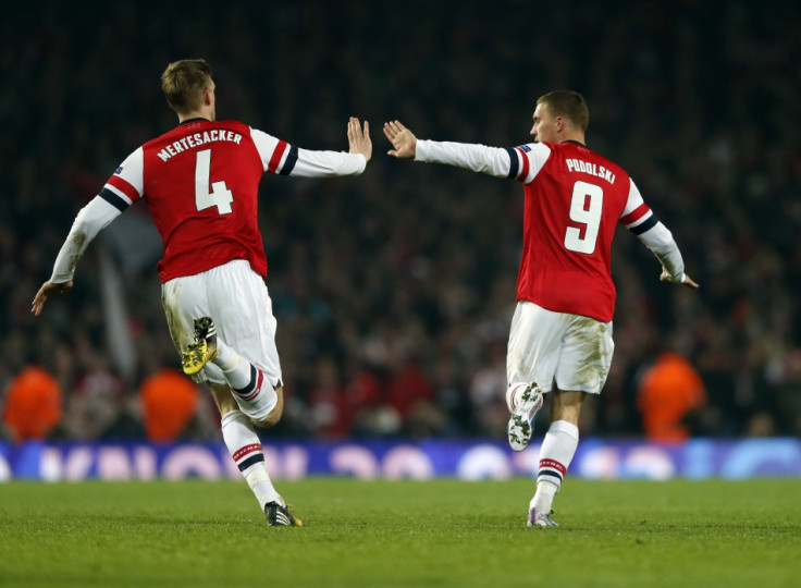 Lukas Podolski (R) and Per Mertesacker