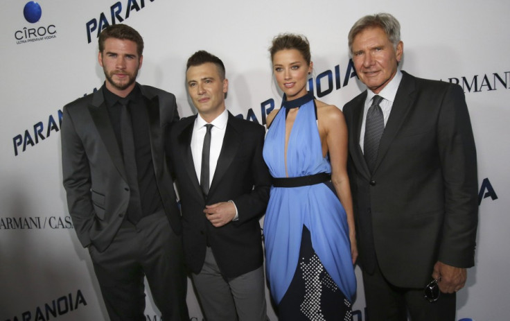 Director of the movie Robert Luketic (2nd L) poses with cast members Liam Hemsworth (L), Amber Heard and Harrison Ford (R) at the premiere of "Paranoia" in Los Angeles, California August 8, 2013.
