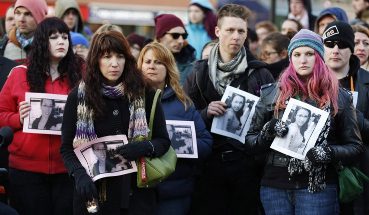 People hold photographs of 17-year-old Rehtaeh Parsons during a memorial vigil at Victoria Park in Halifax, Nova Scotia