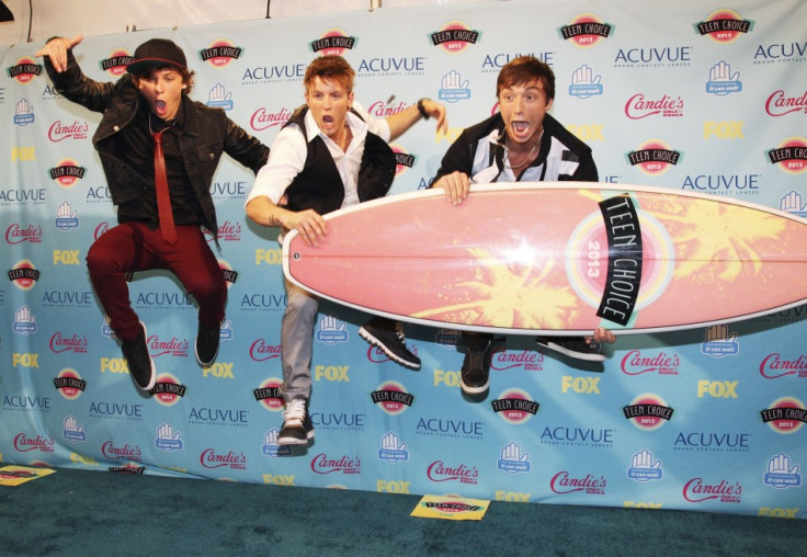 Members of the group Emblem3 leap in the air after winning the Choice Music Breakout Group at the Teen Choice Awards 2013. (Photo: Reuters)