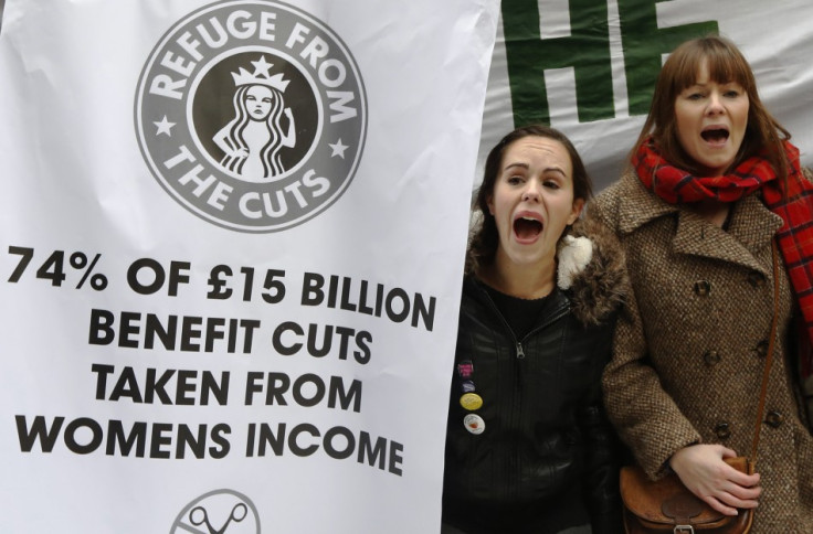 Demonstrators protest outside a Starbucks coffee shop in central London