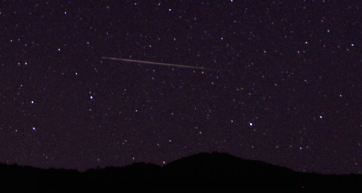 A meteor streaks over the northern skies in the early morning during the Perseid meteor shower north of Castaic Lake, California August 12, 2013. (Photo: Reuters)