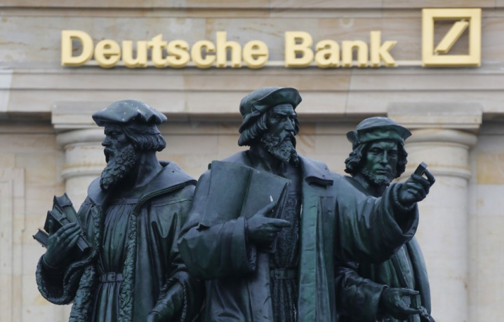 A statue is pictured in front of the former head quarters of Germany's largest business bank, Deutsche Bank in Frankfurt.