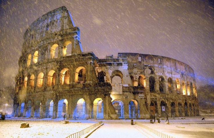 The ancient Colosseum is seen during an heavy snowfalls late in the night in Rome February 4, 2012. American archaeologists have excavated what they are calling a mini colosseum of the gladiator emperor Commodus. (Photo: REUTERS/Gabriele Forzano)