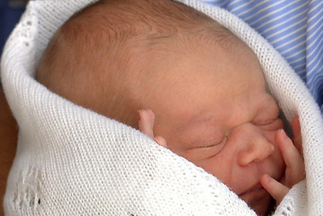 First photo of Prince George taken when Prince William and Kate Middleton showed him to the world, a day after he was born, on 23 July outside St Mary's Hospital. First official portrait of royal baby is set to break earlier Twitter records. (Photo: Reute