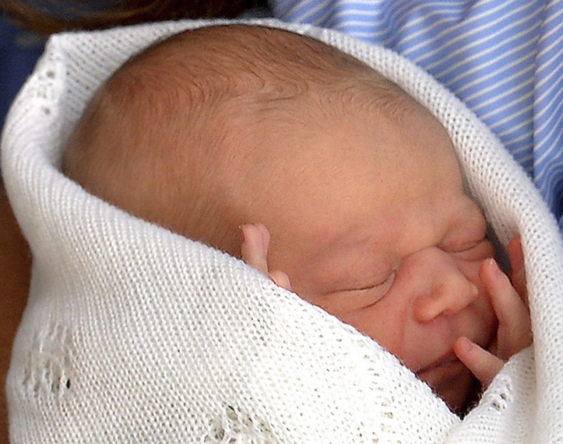 First photo of Prince George taken when Prince William and Kate Middleton showed him to the world, a day after he was born, on 23 July outside St Mary's Hospital. First official portrait of royal baby is set to break earlier Twitter records. (Photo: Reute
