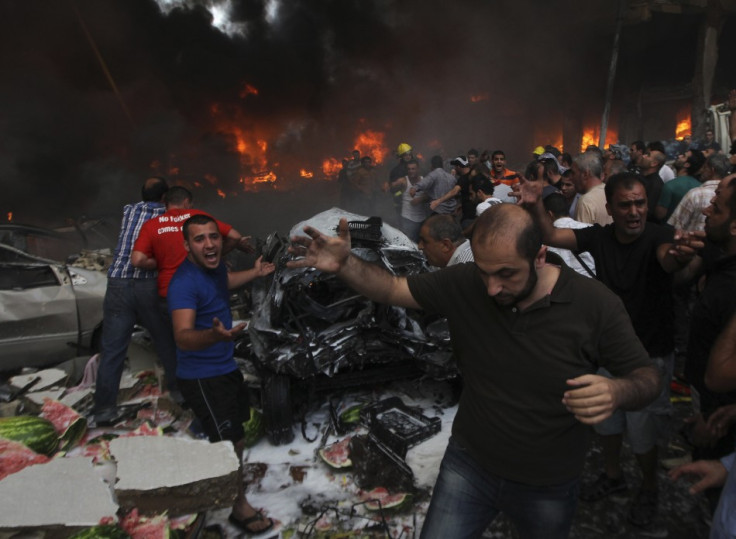 People shout for help at the site of an explosion in Beirut's southern suburbs,