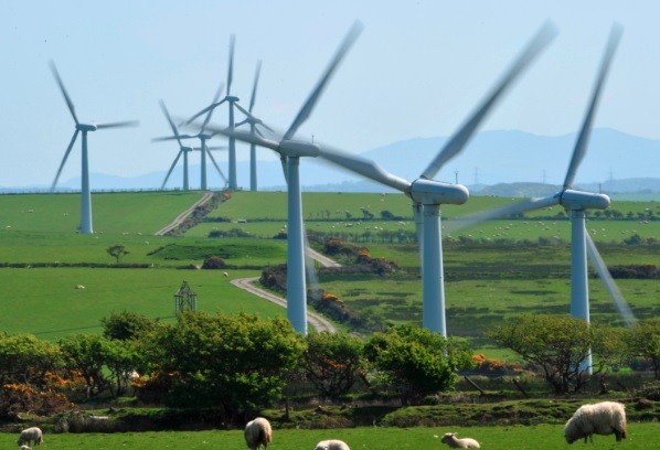A windfarm is seen on Anglesey, north Wales. Britain's government is still investing millions into the renewable energy sector. (Photo: Reuters) A windfarm is seen on Anglesey, north Wales. Britain's government is still investing millions into the renewable energy sector. (Photo: Reuters)