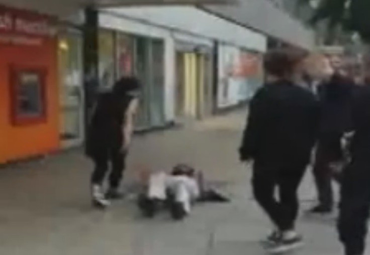 Young woman continues abusing OAP after pushing him to the ground