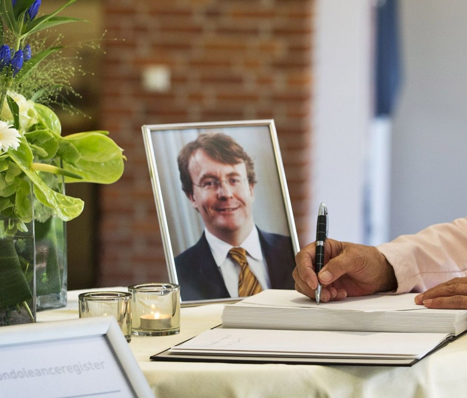 A woman signs the condolence register for Prince Johan Friso of the Netherlands at the town hall of Ermelo August 13, 2013. Prince Friso, the brother of the new Dutch king, died on Monday in a royal palace in The Hague, 18 months after a skiing accident l