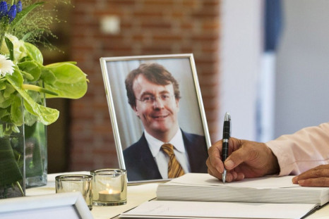 A woman signs the condolence register for Prince Johan Friso of the Netherlands at the town hall of Ermelo August 13, 2013. Prince Friso, the brother of the new Dutch king, died on Monday in a royal palace in The Hague, 18 months after a skiing accident l