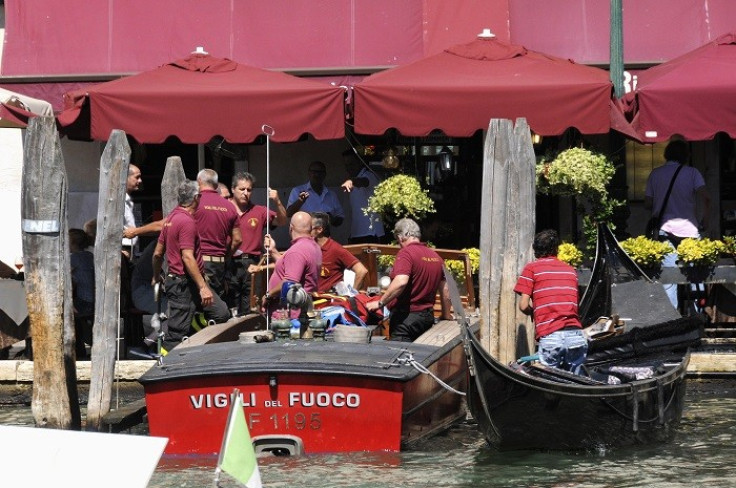 Firefighters transport a gondola after it crashed with a ferry boat at the Grand Canal in Venice, resulting in the death of a German tourist