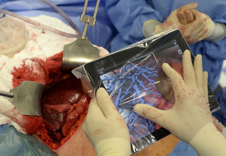 The tablet computer helps doctors to access and visualize planning data during liver surgery, one of the first liver surgeries of its kind in Germany. (Photo: REUTERS/Fabian Bimmer)