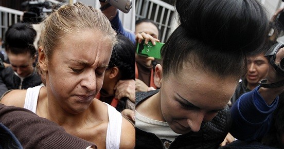 Melissa Reid (L) and Michaella McCollum are escorted by police after leaving the public prosecutor's office at Callao (Reuters) Melissa Reid (L) and Michaella McCollum are escorted by police after leaving the public prosecutor's office at Callao (Reuters)