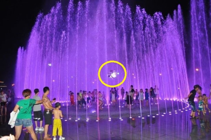 Boy blasted in to air by water feature in Enshi, China