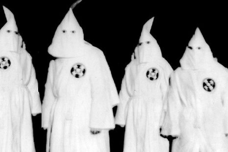 Ku Klux Klan members in full hooded regalia